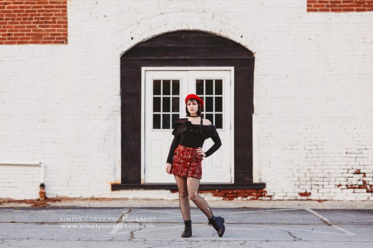 West Georgia photographer, fashion shoot with girl in red by white brick wall