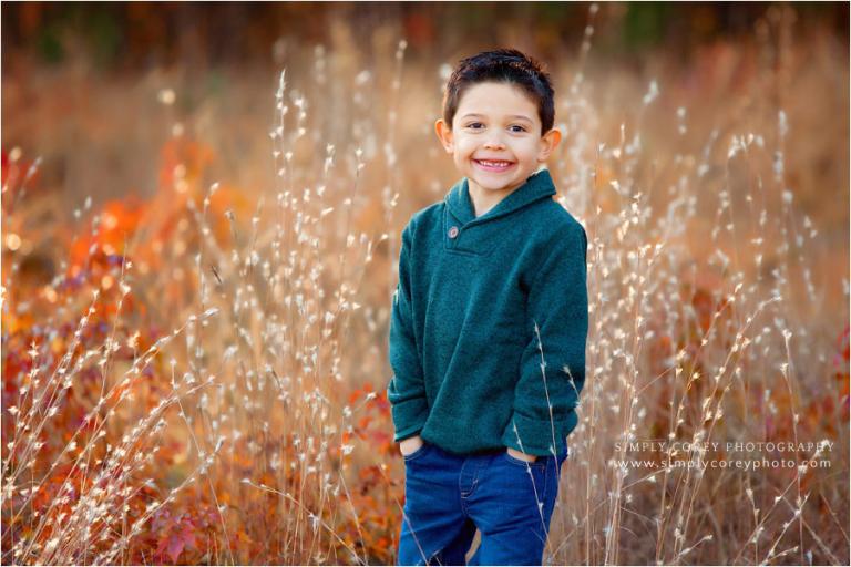Newnan photographer, child in field during fall mini session