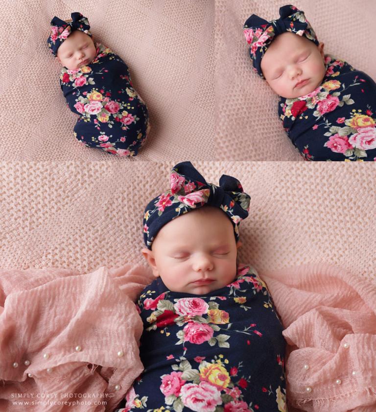 Douglasville newborn photographer, baby in floral swaddle on pink