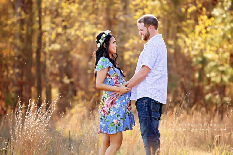Douglasville maternity photographer, expecting couple in a golden field