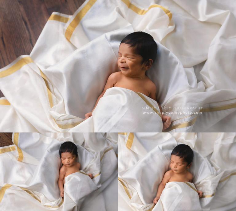 Carrollton newborn photographer, baby boy smiling in a dhoti