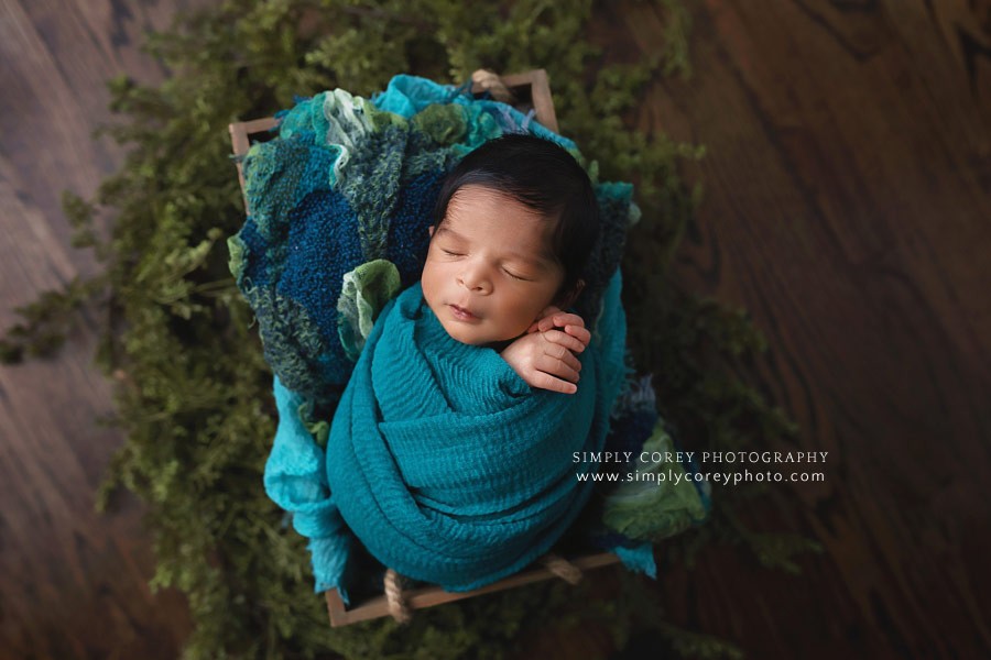 Peachtree City newborn photographer, baby boy swaddled in teal