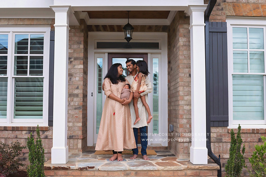 West Georgia photographer, family at home on porch with newborn