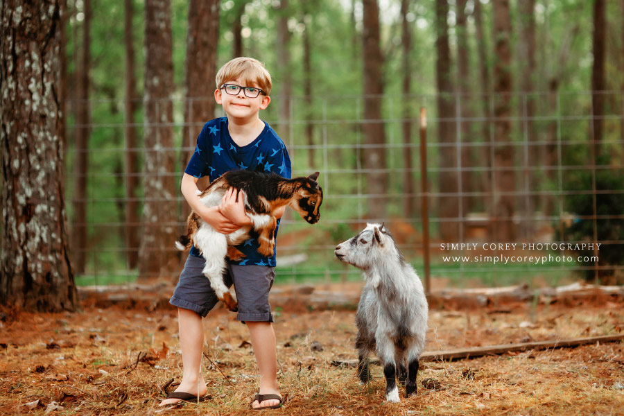 Atlanta lifestyle photographer, boy holding baby goat