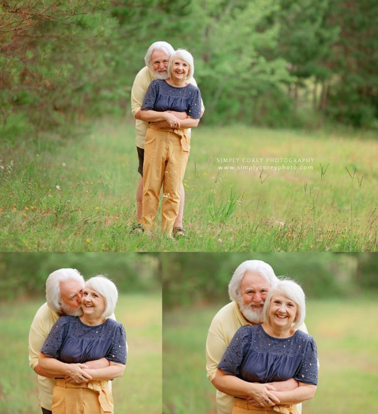 Douglasville couples photographer, grandparents hugging outside in field