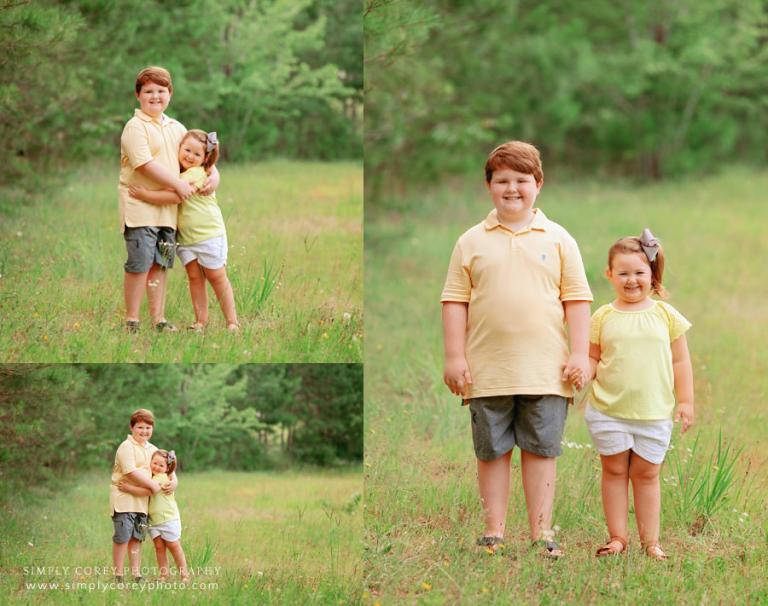 Villa Rica family photographer, kids hugging outside in field