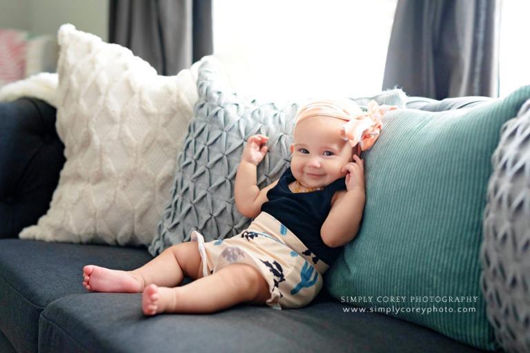 Atlanta lifestyle photographer, baby at home on couch with pillows