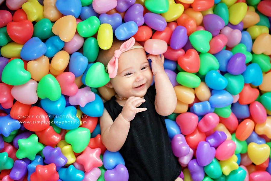 Douglasville baby photographer, baby in heart ball pit during in-home session