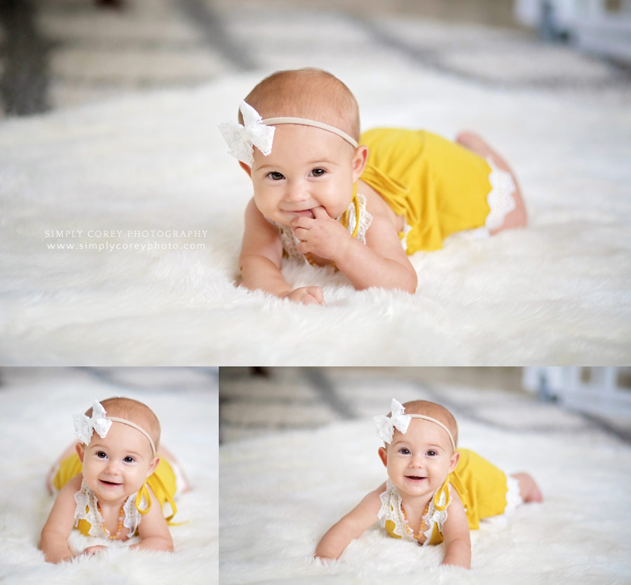lifestyle photographer near Carrollton, GA; baby in yellow romper on fuzzy blanket