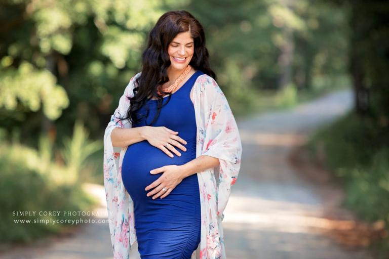 Atlanta maternity photographer, pregnant mom in blue dress and kimono laughing outside