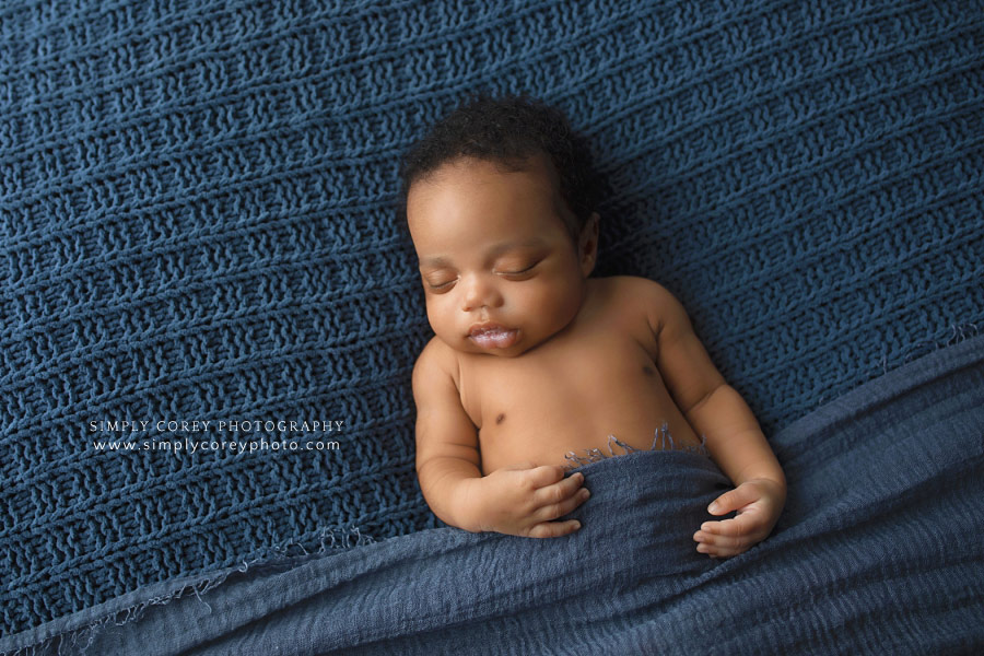 newborn photographer near Douglasville, baby boy sleeping on blue blanket
