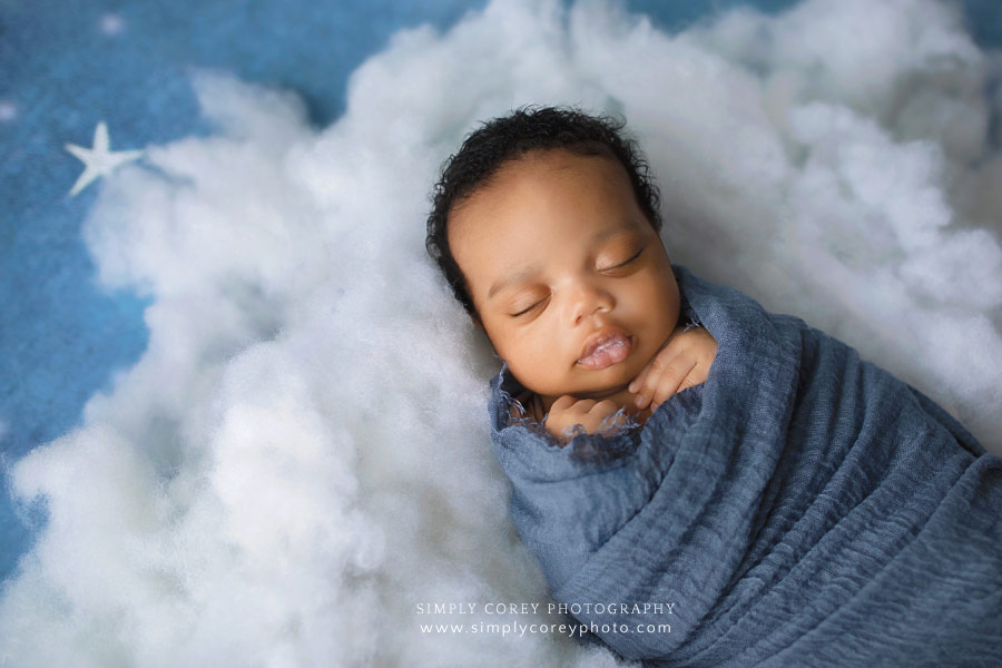 newborn photographer near Villa Rica, baby boy on cloud studio set