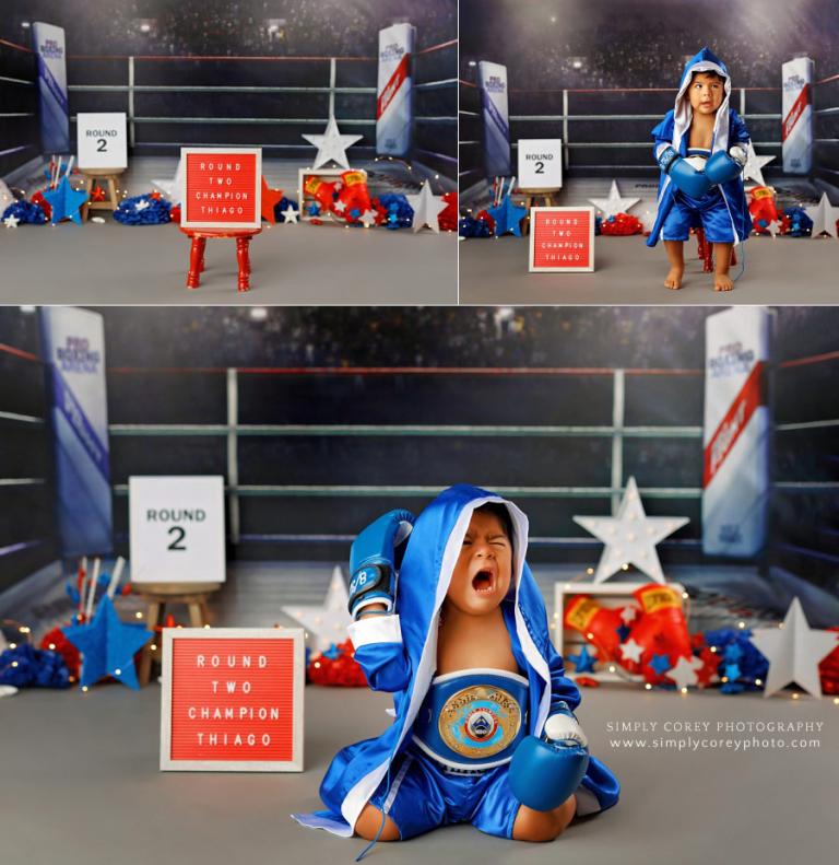 Carrollton baby photographer, toddler crying during session in boxing robe