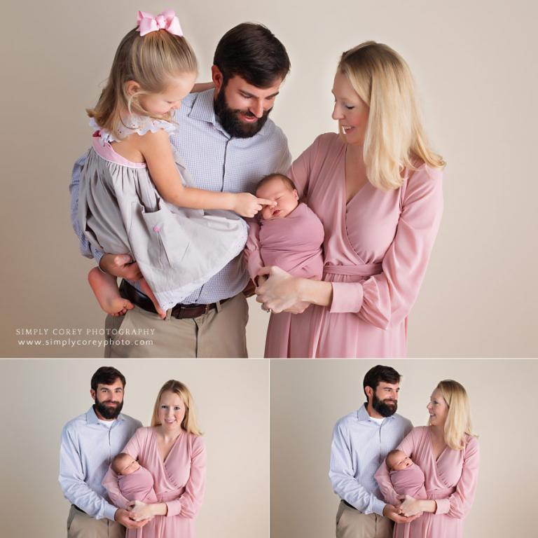 newborn photographer near Bremen, big sister touching baby's nose