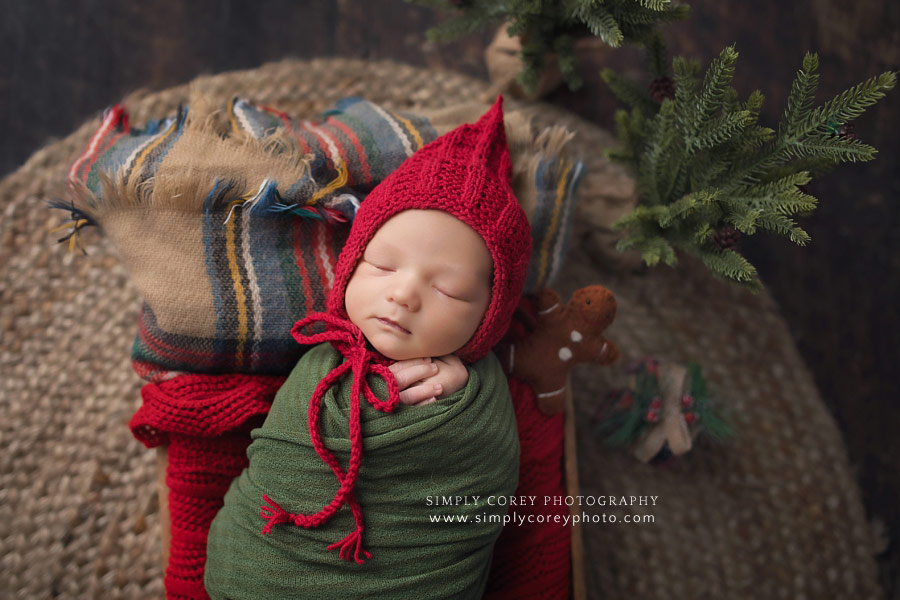 newborn photographer near Newnan, baby boy in red hat for Christmas