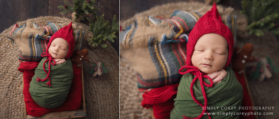 newborn photographer near Peachtree City, baby boy in a red hat with a Christmas set