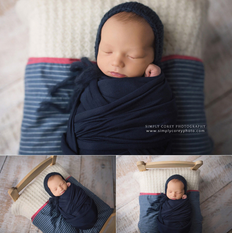 newborn photographer near Dallas, Georgia; baby boy in navy blue on a little bed
