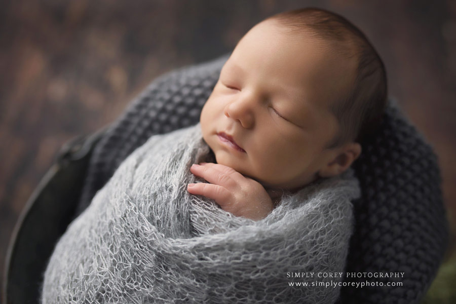 newborn photographer in West Georgia; baby boy in gray knit wrap