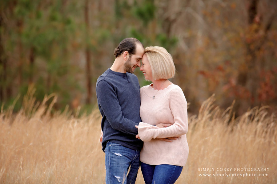 couples photographer near Hiram, couple outside in field with tall grass