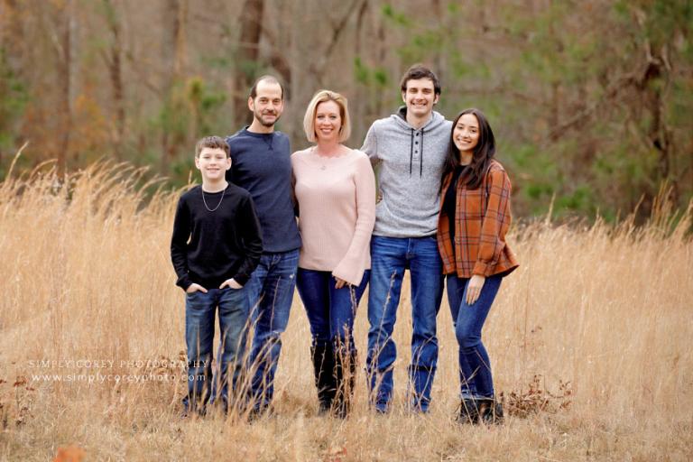 family photographer near Hiram, outdoor portraits in a field in December