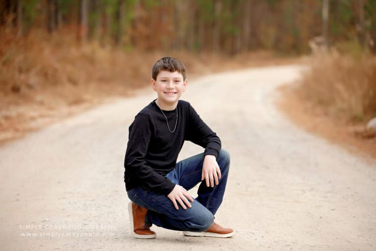 Villa Rica children's photographer, tween boy outside on dirt road