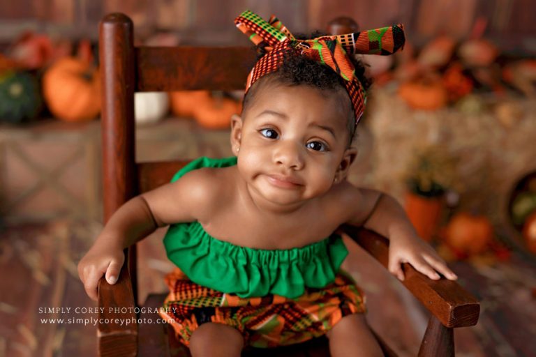 Atlanta baby photographer, girl in African print for fall milestone session in studio