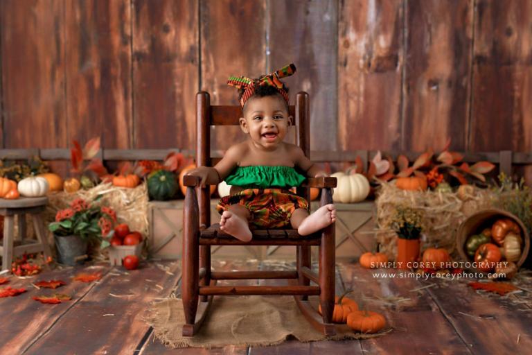 Douglasville baby photographer, girl in African print outfit for a fall milestone session