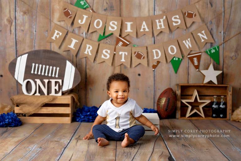baby photographer near Austell, football theme for one year studio session