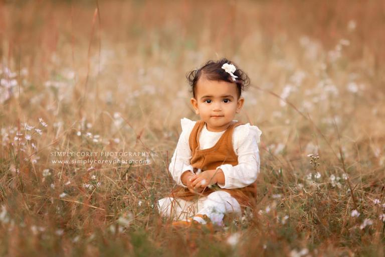 baby photographer near Carrollton, GA; toddler outside in a field