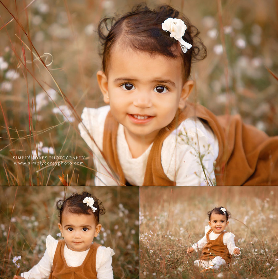 baby photographer near Peachtree City, toddler outside in field with flowers