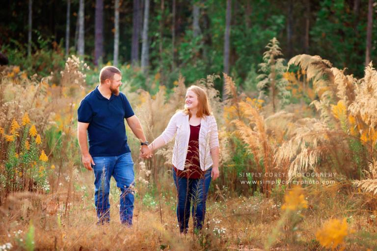 Carrollton couples photographer, parents walking in field during family session