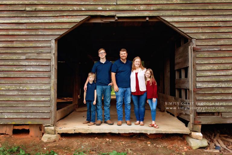 family photographer near Dallas, GA; outdoor portrait with old barn