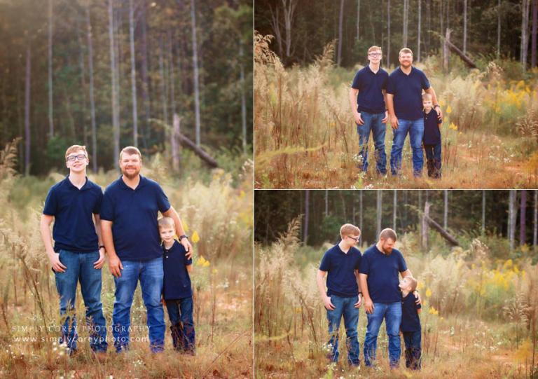 family photographer near Douglasville, outdoor portraits of dad and sons in field