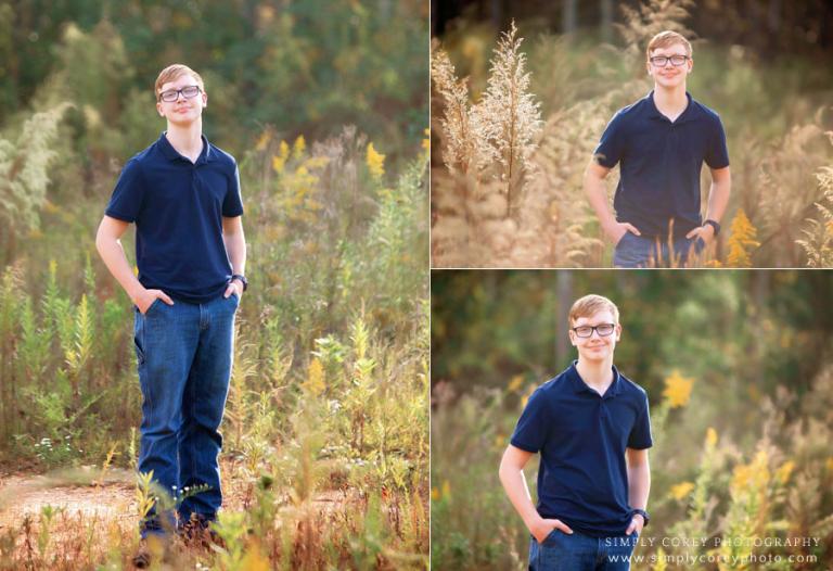 senior portrait photographer near Dallas, GA; teen outside in a field