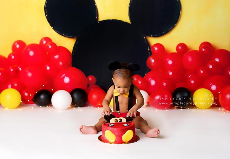 Atlanta cake smash photographer, baby in a Mickey outfit in studio