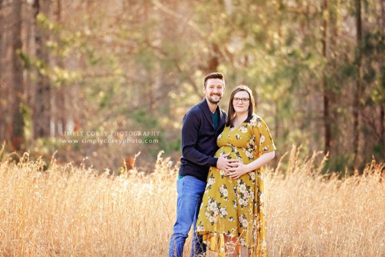 Villa Rica maternity photographer, couple outdoors in a field
