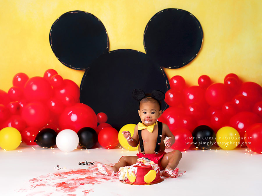 cake smash photographer near Atlanta, baby in bowtie for Mickey studio session
