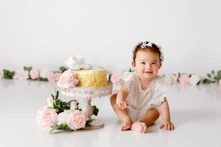 cake smash photographer near Peachtree City, baby girl with pink flowers
