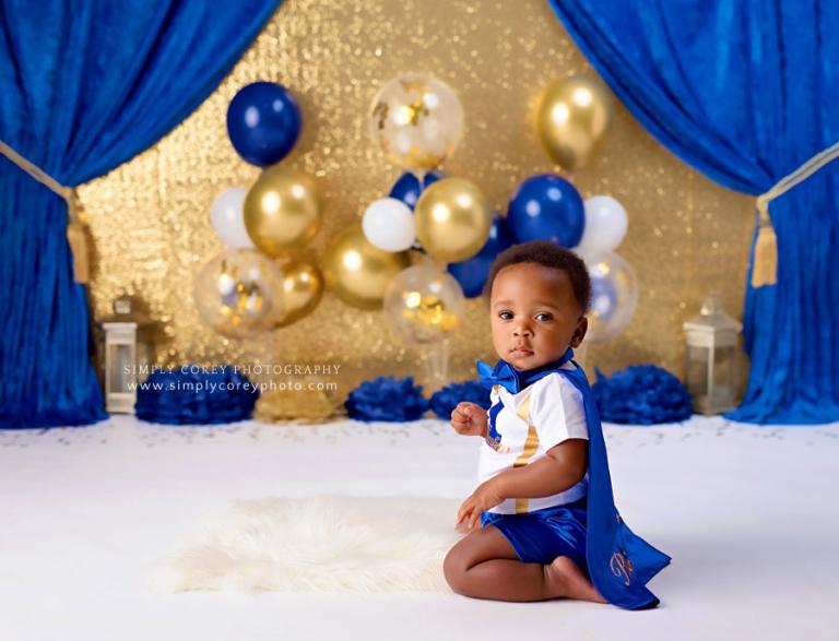 baby photographer near Dallas, GA; royal blue and gold prince cake smash