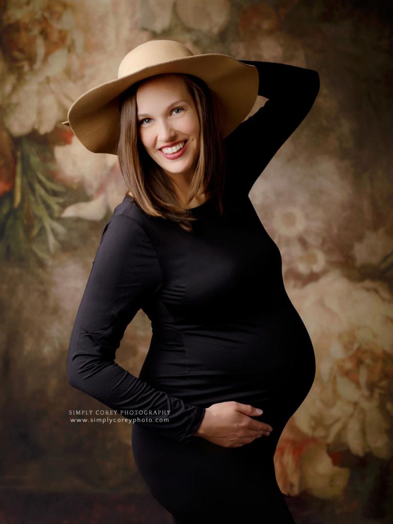 Atlanta maternity photographer, pregnant mom in black dress and boho hat