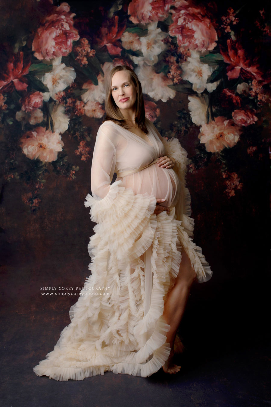 Carrollton maternity photographer in Georgia, mom wearing tulle robe in studio