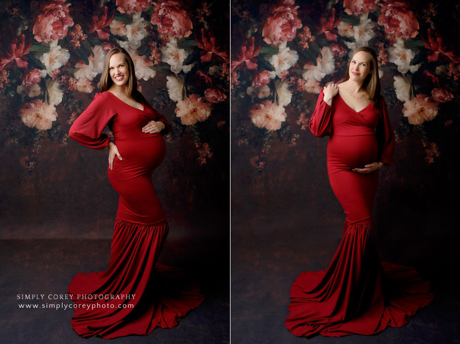 maternity photographer near Carrollton, GA; mom in red dress with floral studio backdrop