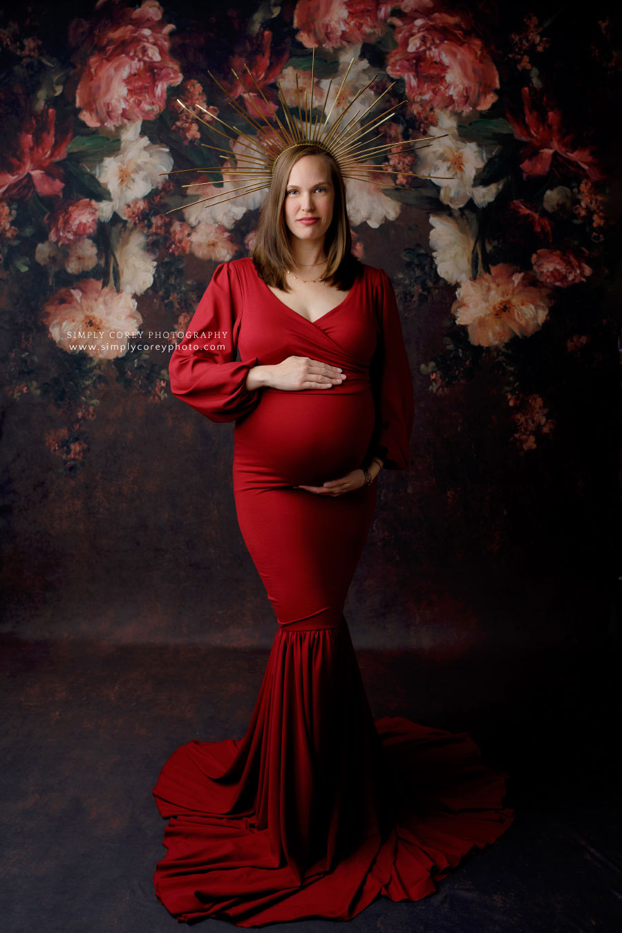 Newnan maternity photographer, studio portrait with red dress and floral backdrop