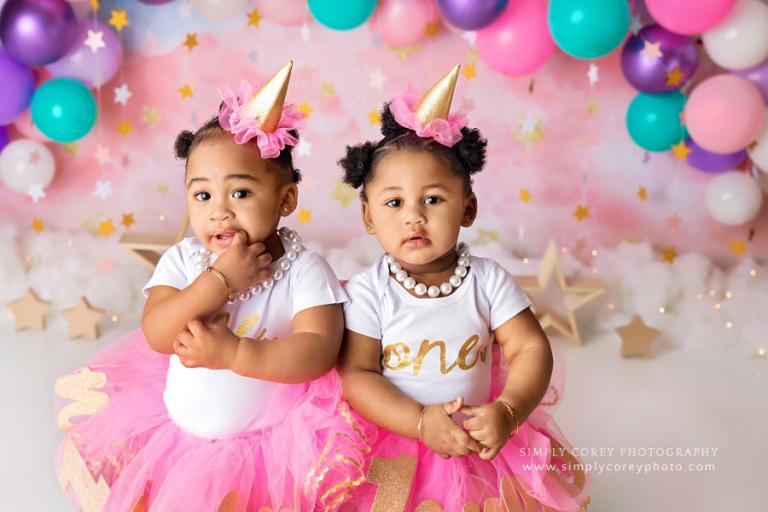 Peachtree City baby photographer, twins with pink purple teal balloon garland