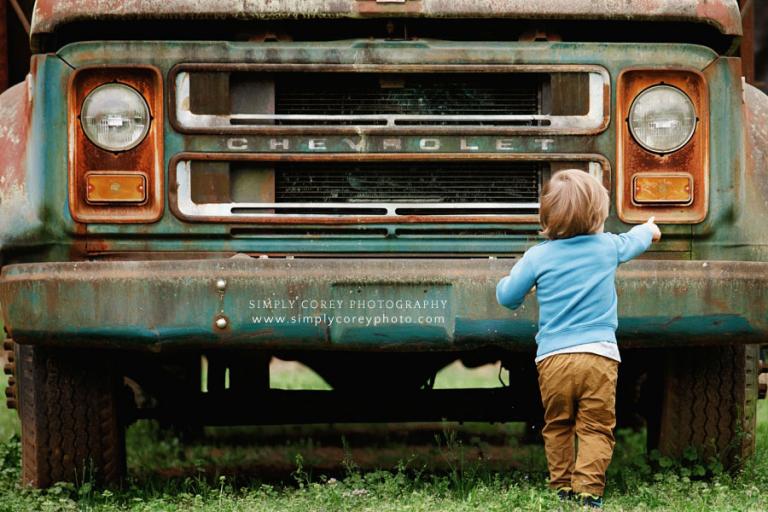 Carrollton kids photographer in Georgia, toddler outside by vintage Chevrolet truck