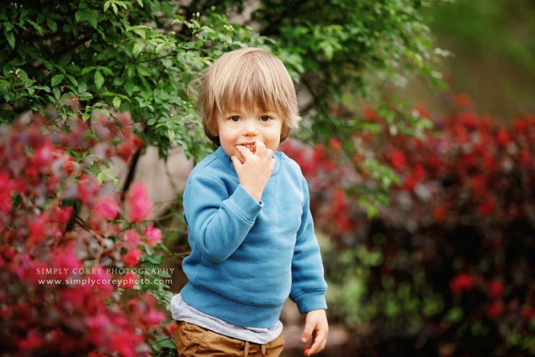 West Georgia photographer, shy child outside in spring blossoms