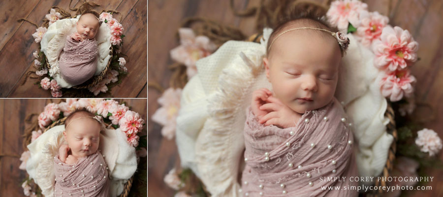 Carrollton newborn photographer in Georgia, baby in basket with pink pearl swaddle and flowers