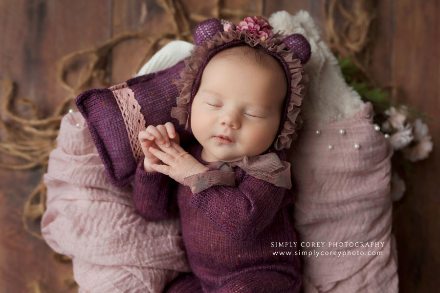 newborn photographer near Atlanta, baby girl in purple teddy bear sleeper set