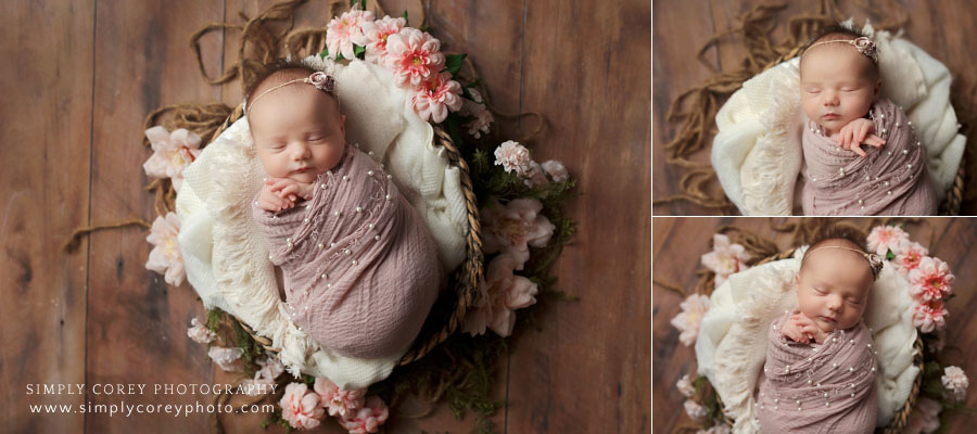 newborn photographer near Douglasville, baby girl in basket with pink wrap and flowers