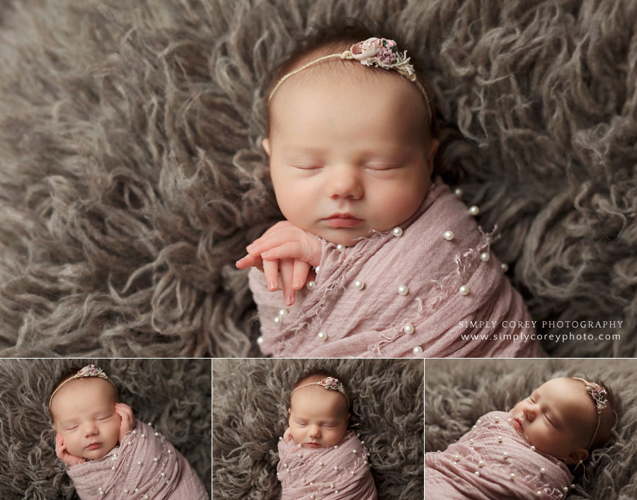 newborn photographer near Senoia, GA; baby girl in pink pearl wrap on flokati